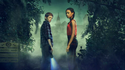 HD desktop wallpaper featuring two characters from Secrets of Sulphur Springs amidst a misty, mysterious backdrop with a flashlight and an eerie mansion.