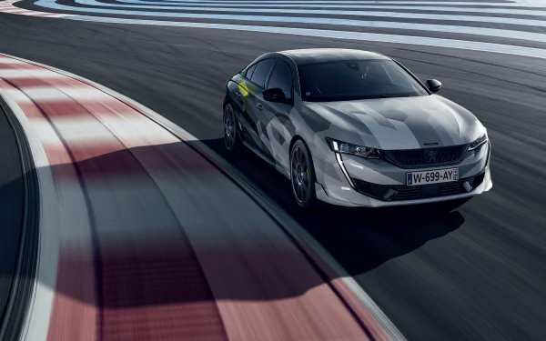Silver Peugeot 508 car speeding on a racetrack, captured in 4K Ultra HD for a dynamic desktop wallpaper.