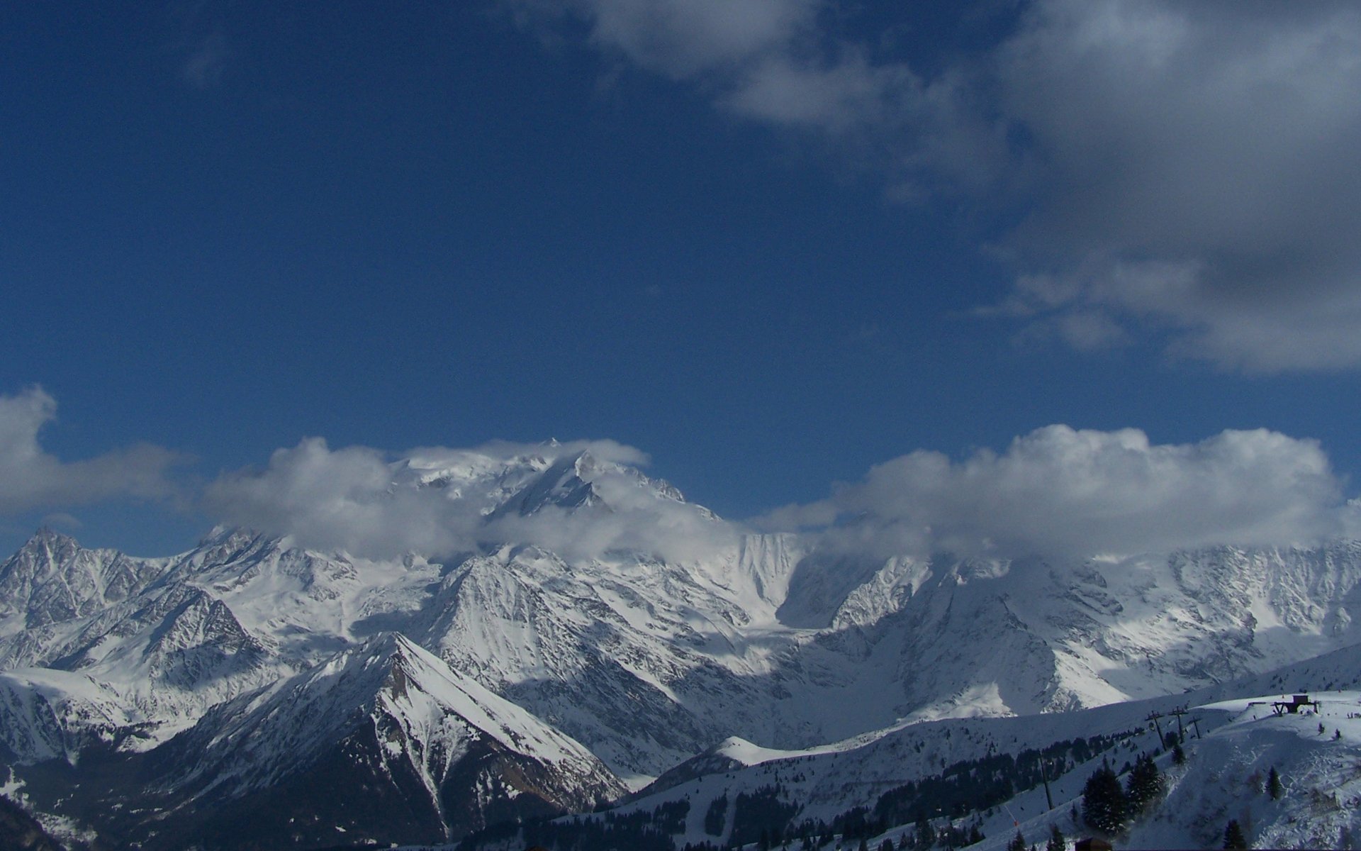Snow-covered Alps under a deep blue sky with drifting clouds — nature scene, HD PC desktop wallpaper and background.