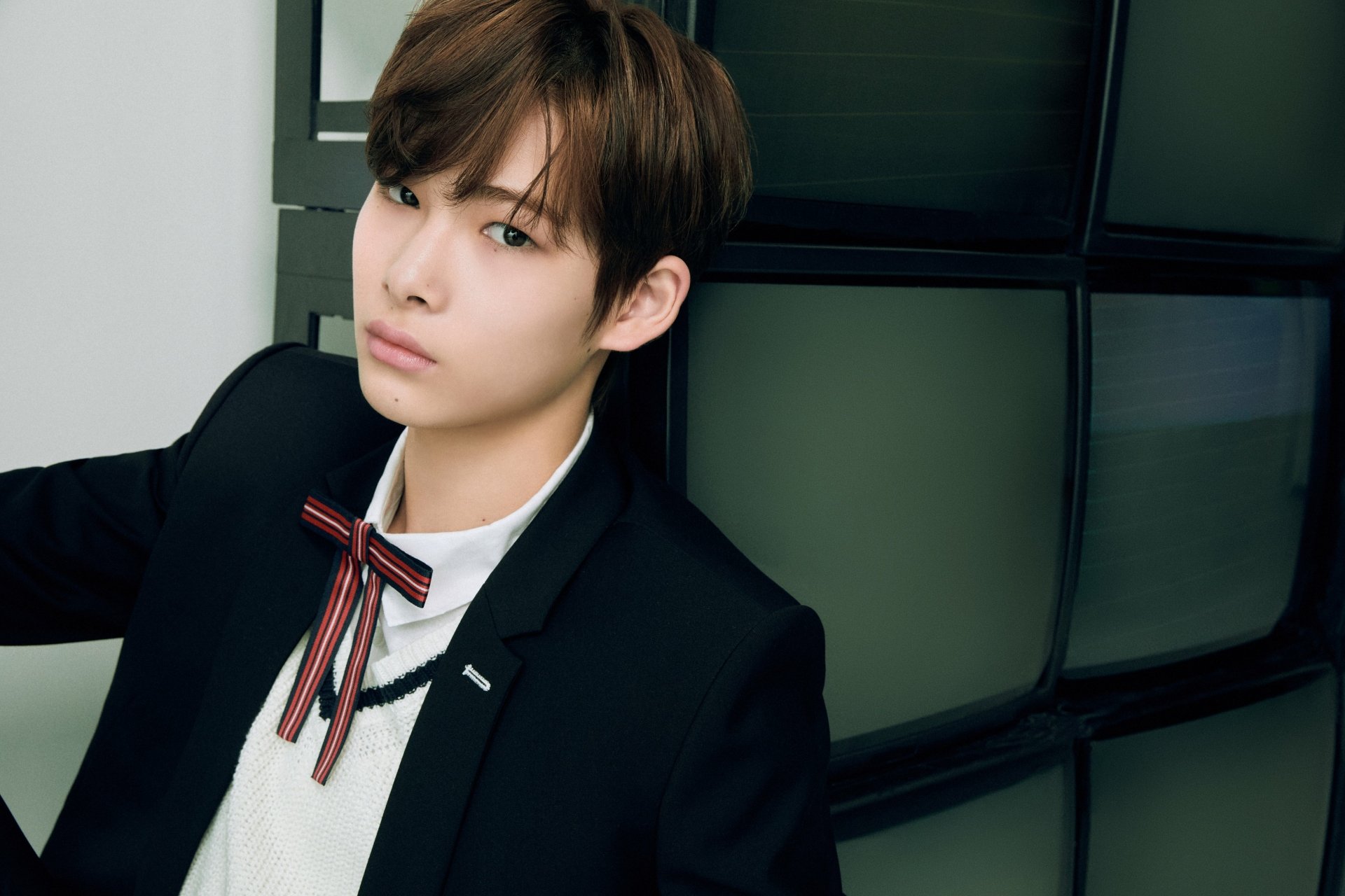 HD desktop wallpaper of a stylish individual from ENHYPEN posing elegantly for a background image.