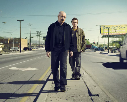 4K Breaking Bad TV desktop wallpaper: a bald middle-aged man and a younger man walk down a sunlit street past a Better Call Saul billboard.