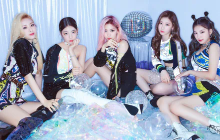 HD desktop wallpaper of the K-pop group ITZY in stylish outfits, posing with disco balls for an electrifying background.