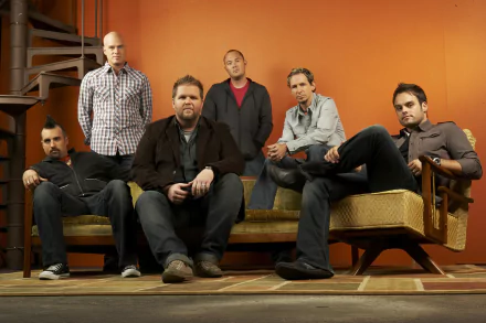 HD desktop wallpaper of the band MercyMe posing together in a warmly lit room.