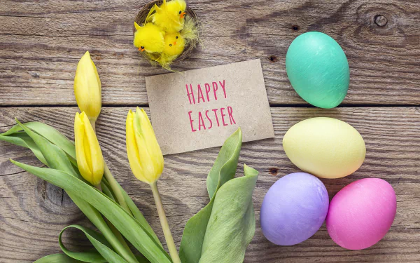 5K Ultra HD Easter holiday PC wallpaper: pastel eggs, yellow tulips, a fluffy chick and a Happy Easter card on a rustic wooden background.