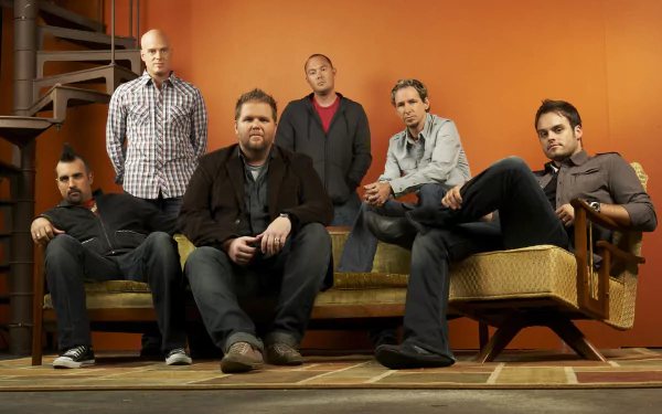 HD desktop wallpaper of the band MercyMe posing together in a warmly lit room.