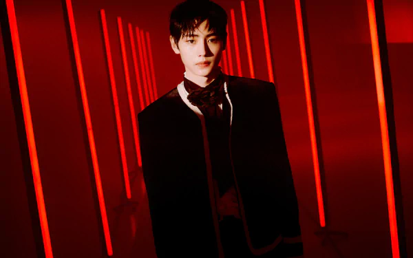 5K Ultra HD PC desktop wallpaper of a K-pop performer standing in a red-lit corridor with a dramatic gaze; tags: music, ENHYPEN.