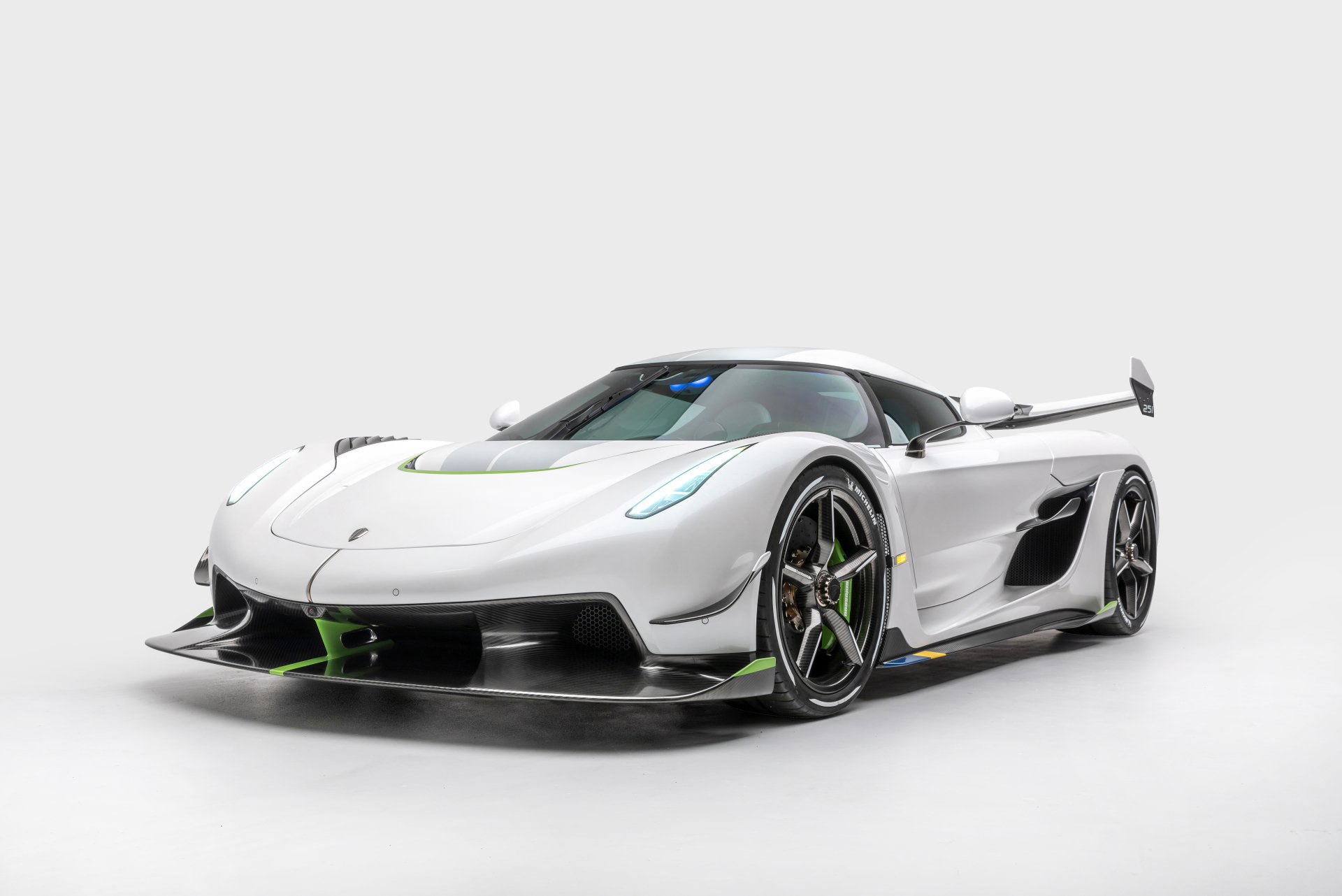 Sleek white Koenigsegg Jesko supercar showcased against a plain background, rendered in stunning 4K Ultra HD for PC desktop wallpaper and background.