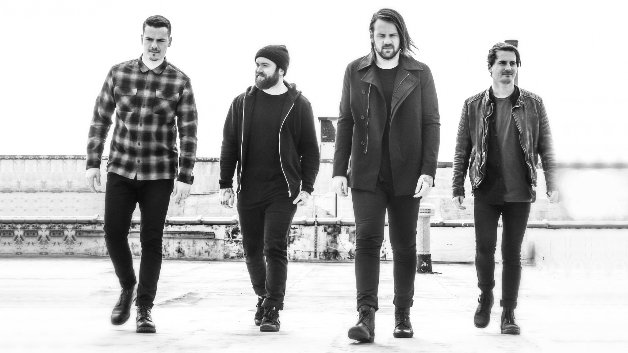 Monochrome HD wallpaper featuring four members of a band walking in unison, suitable for desktop background tagged with Beartooth.