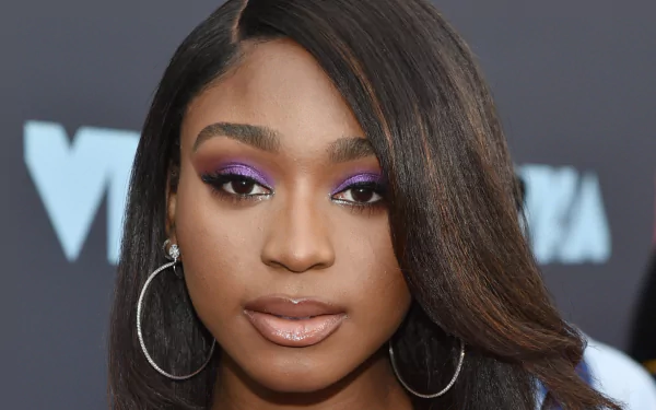 Stunning HD wallpaper featuring Normani, showcasing her bold makeup and signature style, capturing the essence of music and artistry.