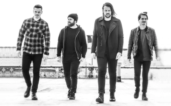 HD desktop wallpaper featuring the band Beartooth in monochrome, walking together with an urban backdrop.