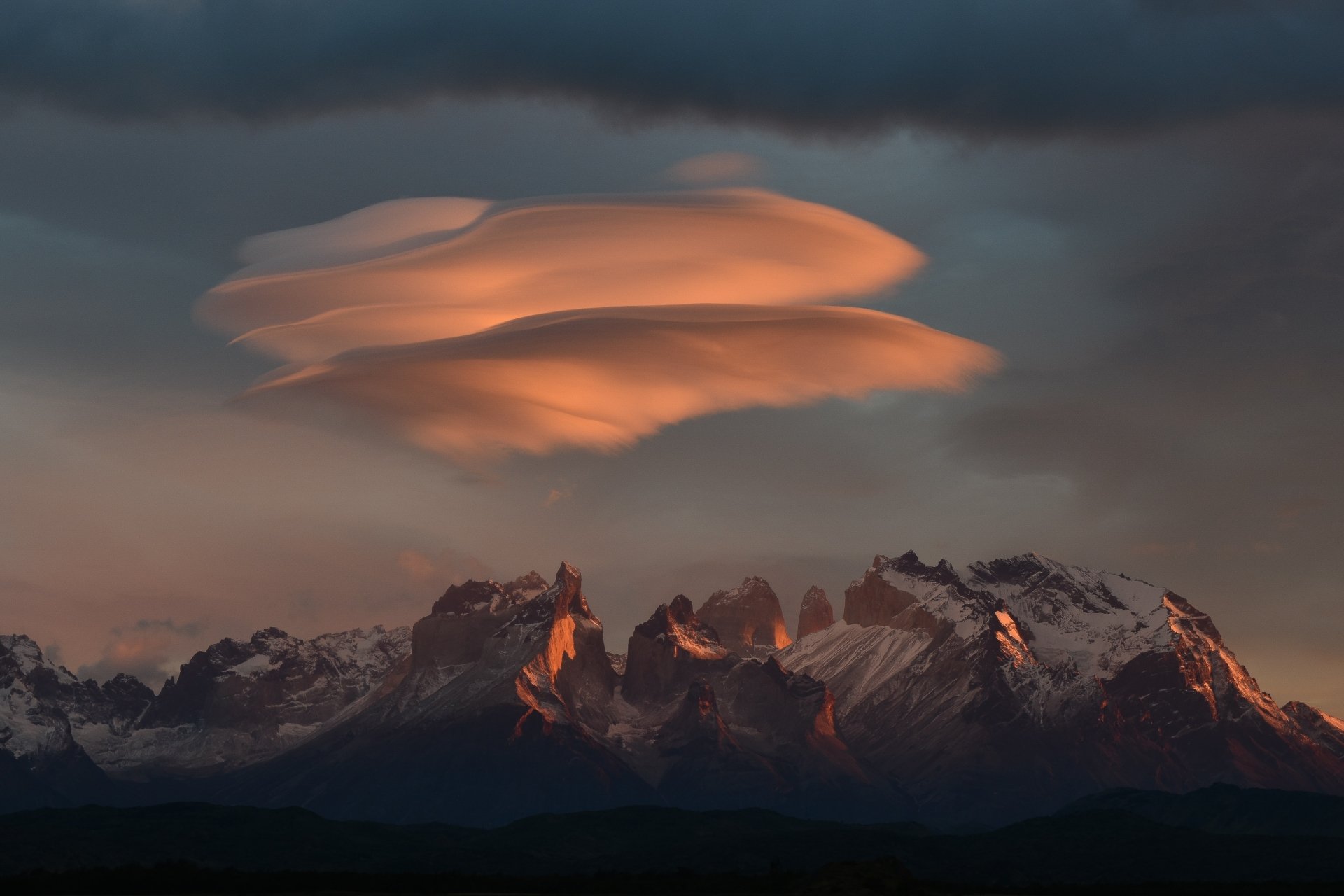 Lenticular clouds at sunrise, Torres del Paine, Chile by Marc Thunis