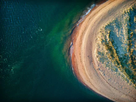  Spring waves breaking over the tip of Dawlish Warren Spit at sunrise, Devon, UK by Red Zeppelin