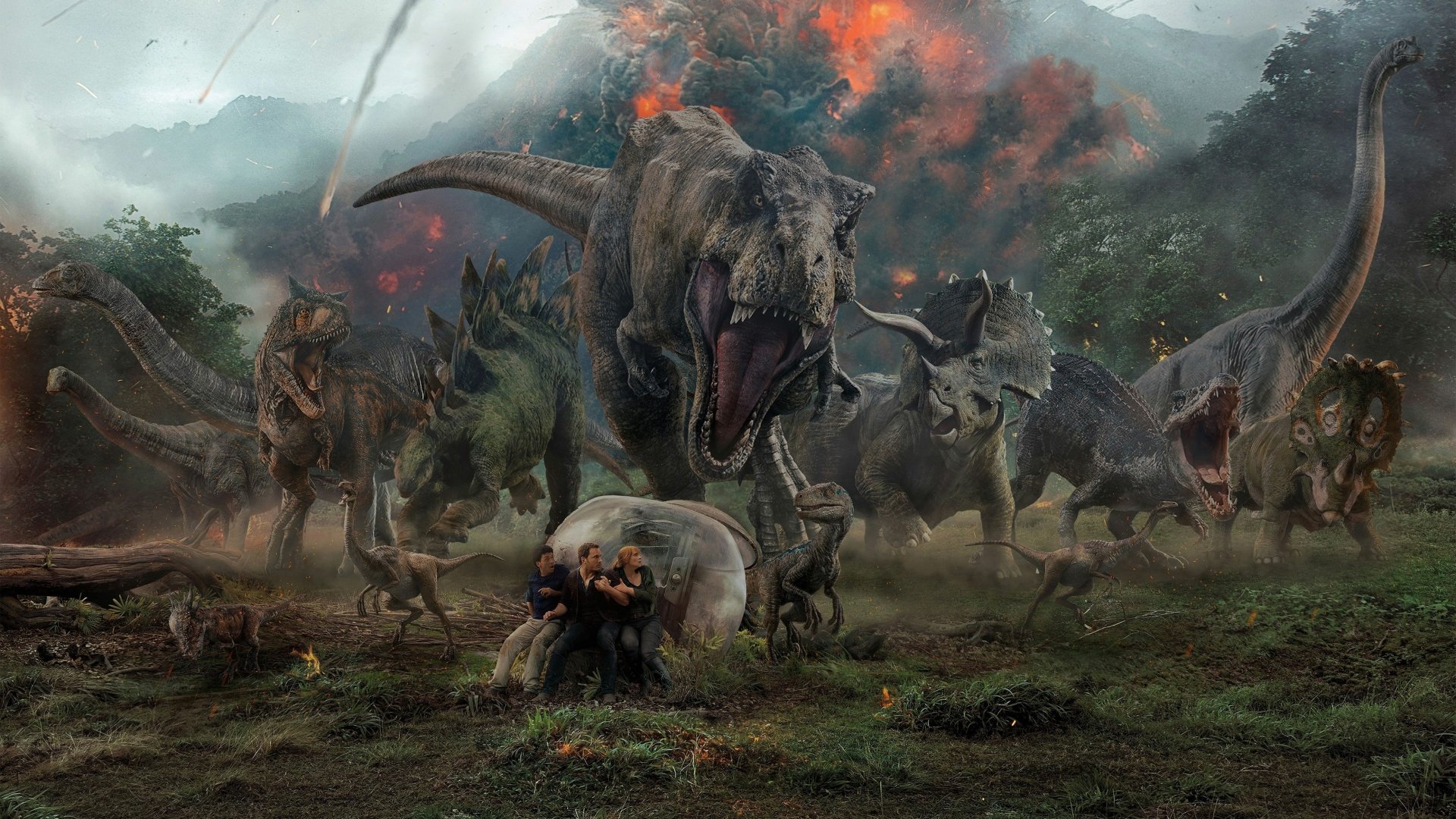 4K Ultra HD Jurassic World: Fallen Kingdom movie wallpaper showing roaring dinosaurs amidst volcanic eruption on a dark, stormy landscape.