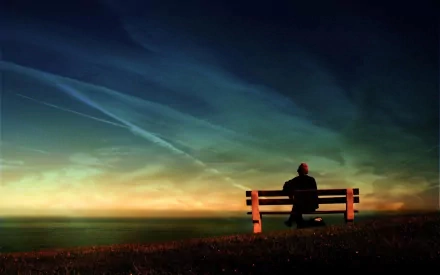 Artistic HD PC desktop wallpaper/background: a silhouetted human sits on a bench at night beneath a vivid, colorful, painterly sky over a tranquil horizon.