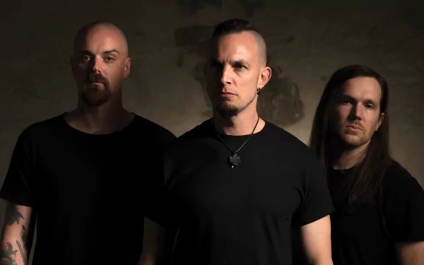 HD desktop wallpaper featuring three members of a band, tagged as Tremonti, standing against a gritty textured background, evoking a strong, intense atmosphere.