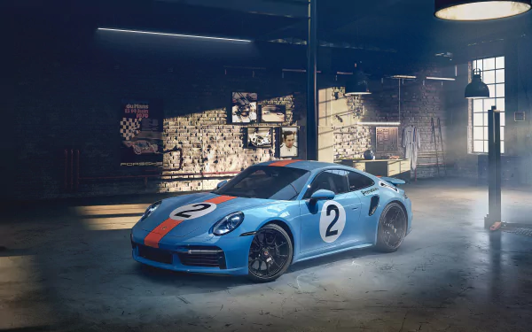 Porsche 911 Turbo S in Gulf blue with racing number 2 parked in a moody garage — Porsche 911 Turbo vehicle, 4K Ultra HD PC desktop wallpaper/background.