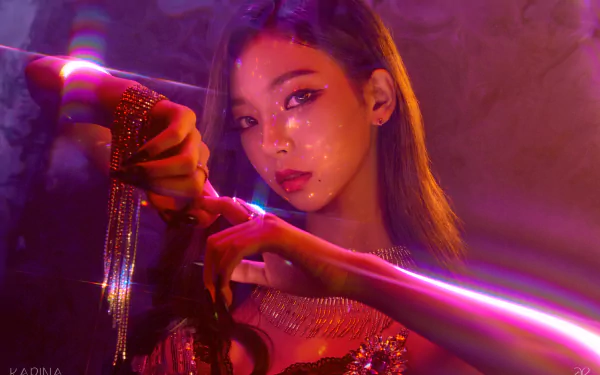 HD PC desktop wallpaper of Karina from Aespa, showcasing her striking pose and vibrant lighting in a music-themed setting.