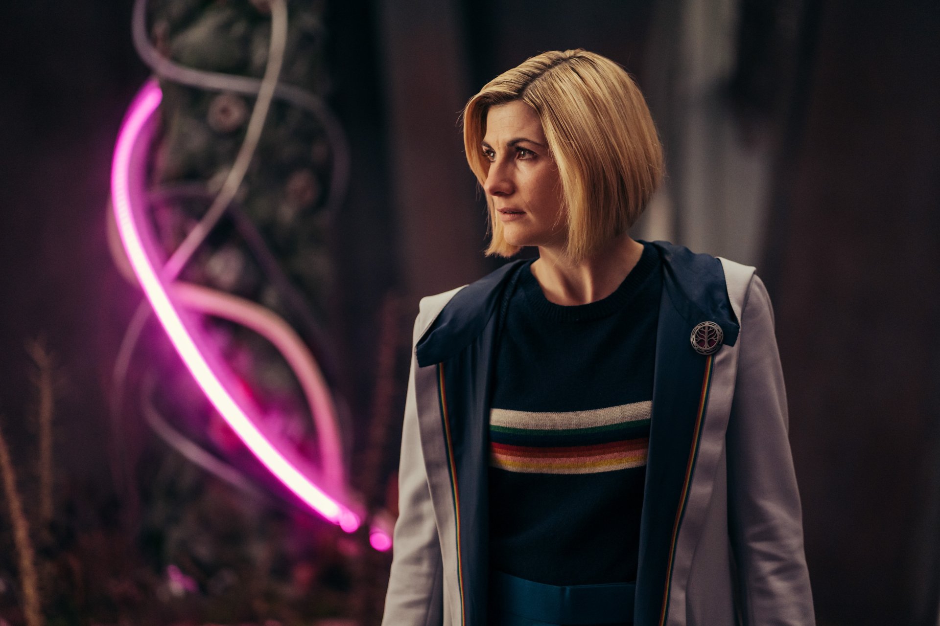 High-resolution 4K wallpaper of Jodie Whittaker as the Thirteenth Doctor from the TV show Doctor Who (2005), featuring vibrant lighting and detailed character design.