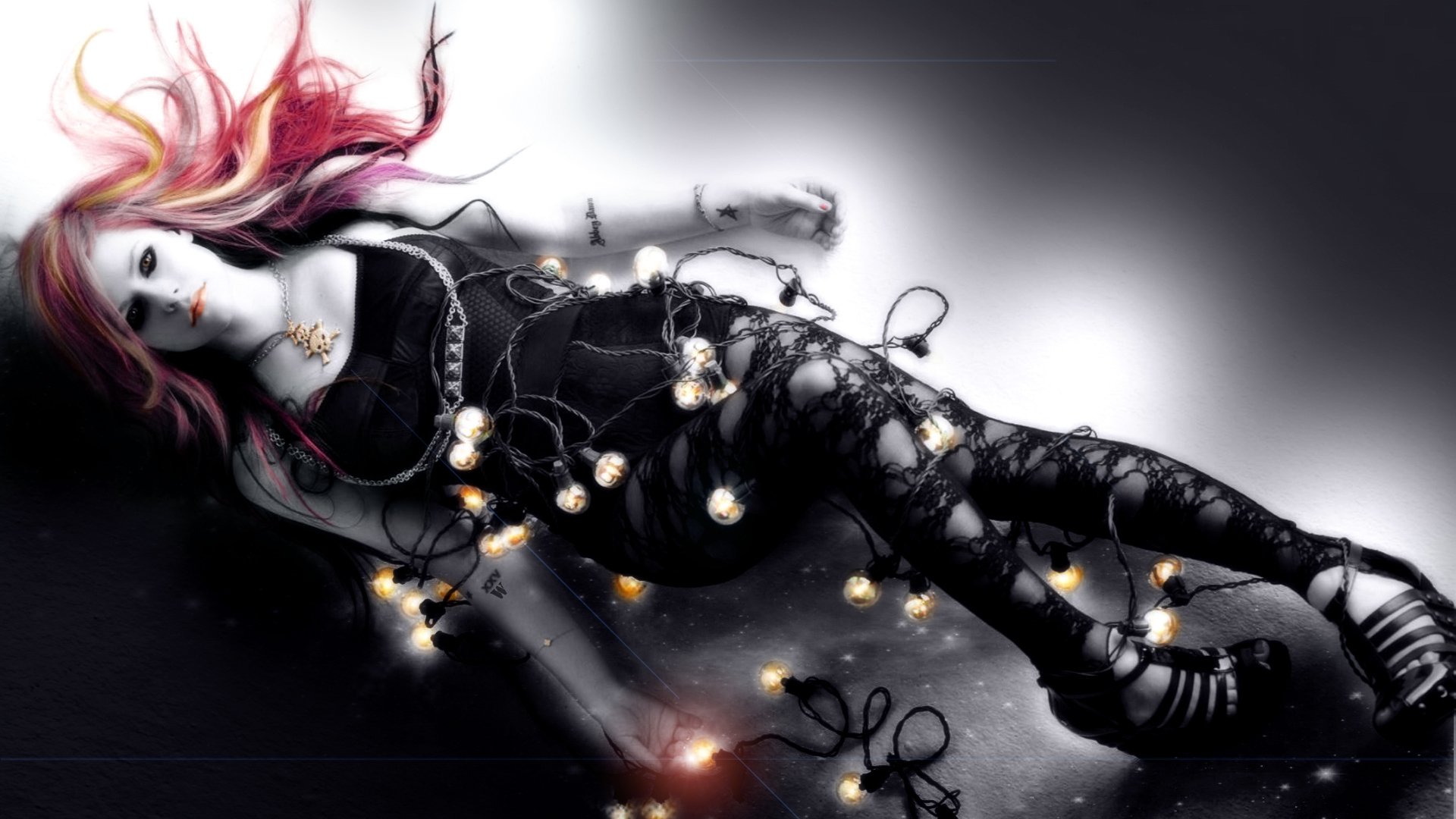 HD PC desktop wallpaper featuring a stylized image of Avril Lavigne with glowing string lights, blending music and edgy artistic elements.