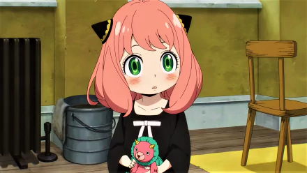 HD desktop wallpaper featuring Anya Forger from the anime Spy x Family, showcasing her with big, expressive green eyes and holding a plush toy, against a domestic background.