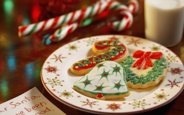 4K Ultra HD desktop wallpaper featuring a festive plate of decorated Christmas cookies with candy canes and a glass of milk in a warm, holiday setting.