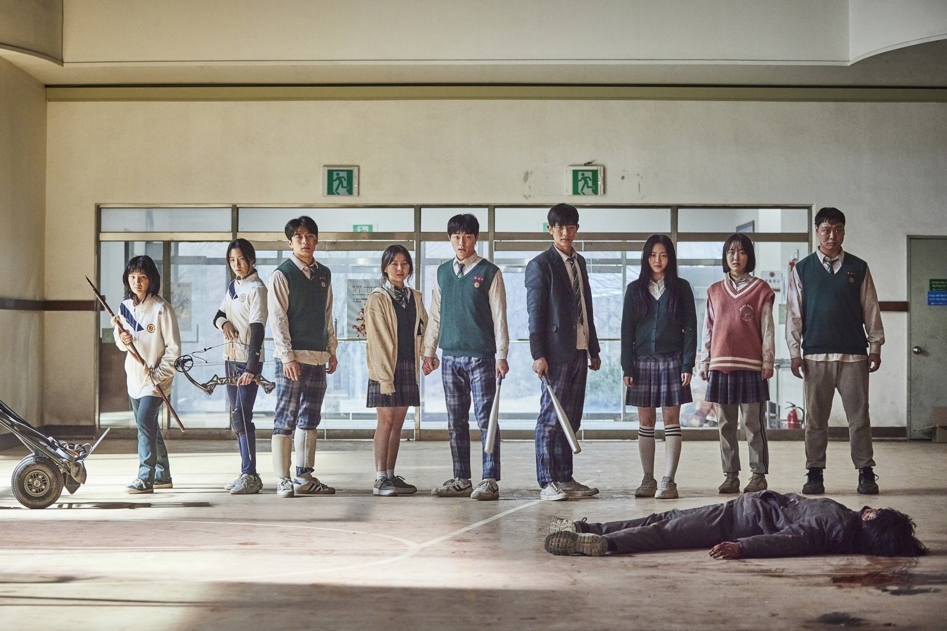 HD PC desktop wallpaper featuring the main cast of the TV show All of Us Are Dead standing in a school hallway with a dramatic, tense atmosphere.