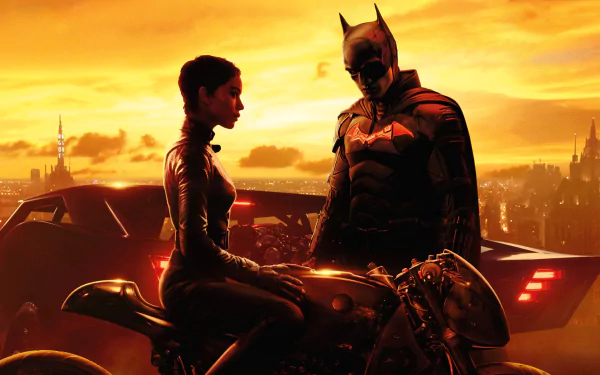 HD desktop wallpaper featuring Batman and Catwoman, portrayed by Zoë Kravitz, with a city skyline at sunset from the movie The Batman.