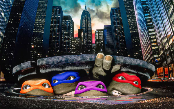 HD PC desktop wallpaper featuring Raphael, Michelangelo, Leonardo, and Donatello from the 1990 Teenage Mutant Ninja Turtles movie peeking out of a city manhole.