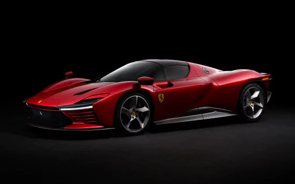 Red Ferrari Daytona SP3 on a black studio backdrop, 2K Quad HD PC desktop wallpaper/background.
