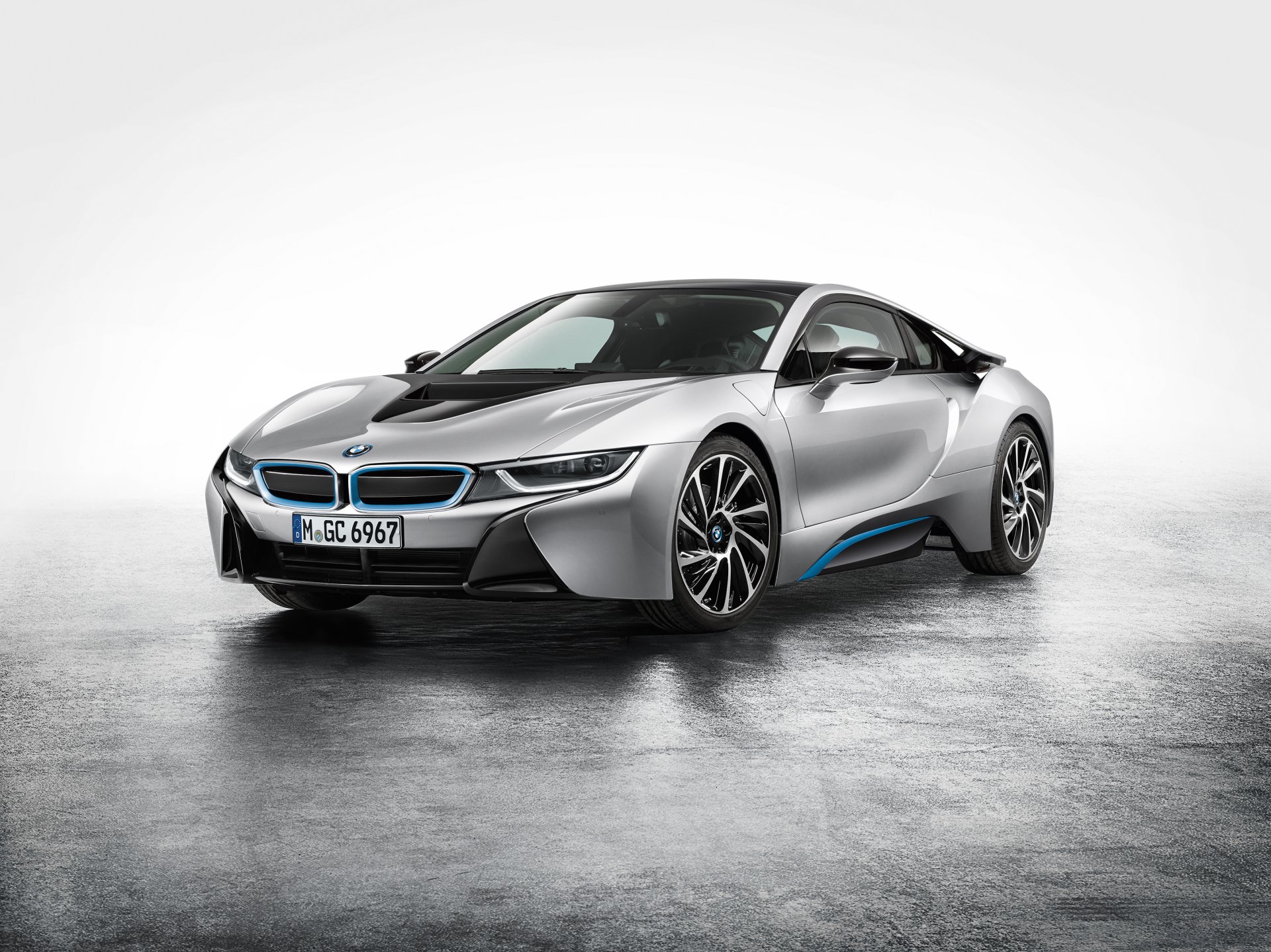 A sleek silver BMW i8 sports vehicle showcased on a reflective surface, featured as an HD PC desktop wallpaper and background.