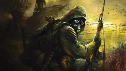 A mysterious figure in a gas mask and tattered clothing holds a weapon, set against a desolate, post-apocalyptic landscape inspired by the S.T.A.L.K.E.R. video game. HD wallpaper.