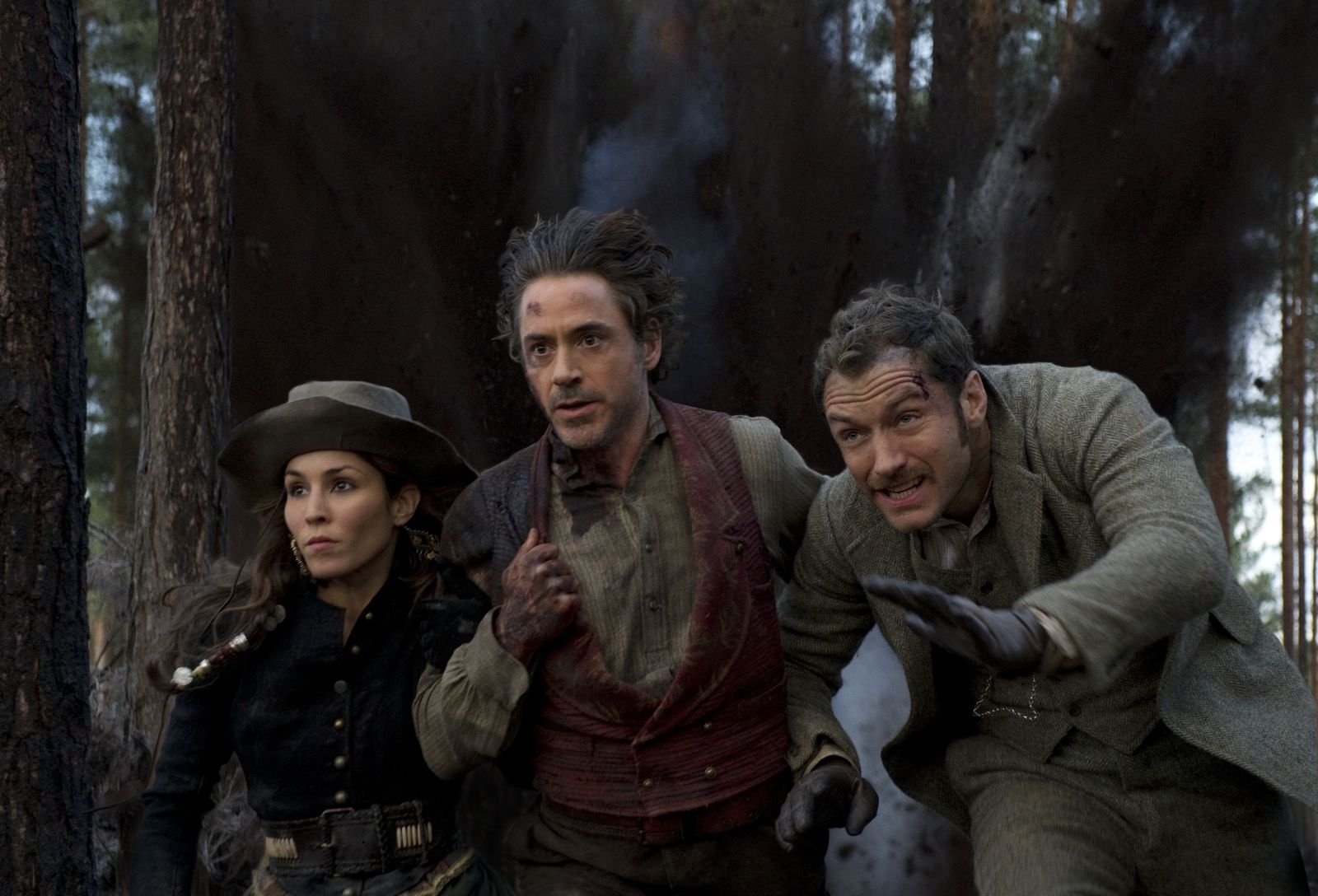 HD PC desktop wallpaper featuring characters from the movie Sherlock Holmes: A Game of Shadows in an intense forest scene.