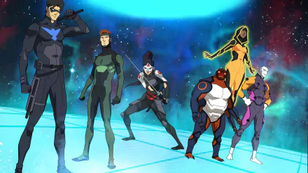 Young Justice TV show HD PC desktop wallpaper: six teenage heroes in colorful suits pose on a glowing platform against a vibrant blue-green cosmic nebula background.