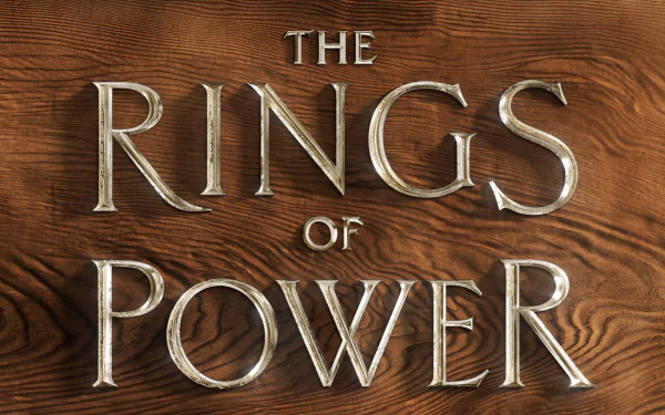 4K Ultra HD PC desktop wallpaper featuring the title design of the TV show The Lord of the Rings: The Rings of Power on a textured wooden background.