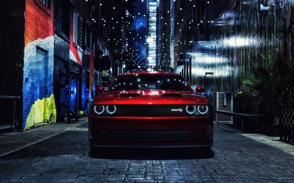 A Dodge vehicle parked in a scenic desktop wallpaper setting.