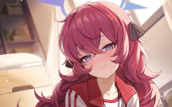 Natsume Iroha from the video game Blue Archive: close-up of pink‑haired girl in a red jacket with headphones, smirking in a sunlit room — HD PC desktop wallpaper/background.