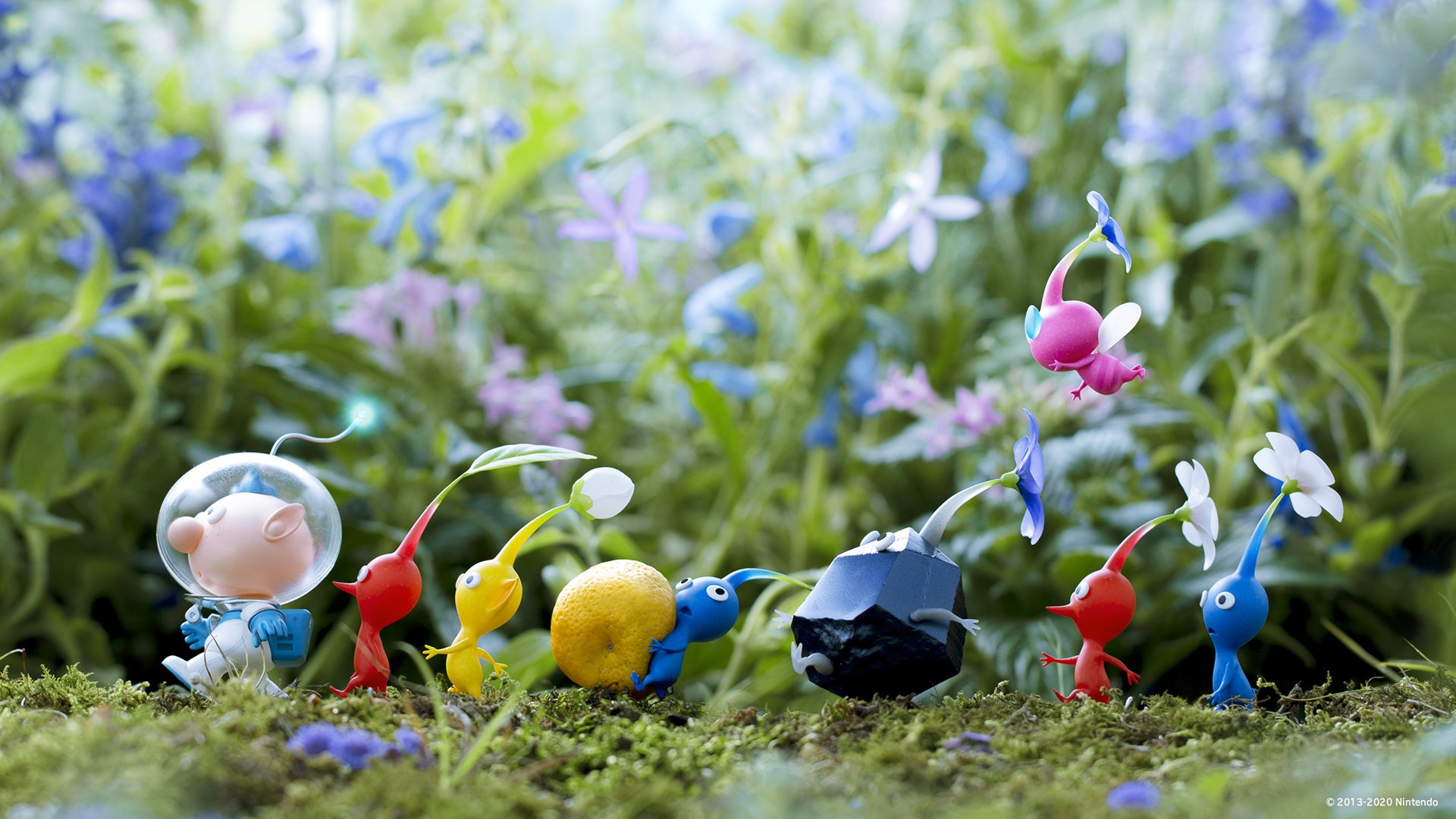 Colorful Pikmin characters from the video game Pikmin 3 traverse a lush garden with blooming flowers. This HD wallpaper brings the whimsical adventure to your desktop background.