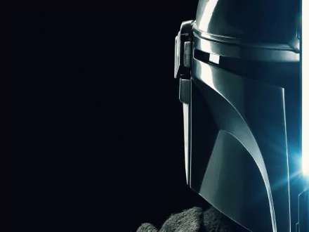 Close-up of The Mandalorian's chrome helmet lit by blue rim light against a black backdrop — 2K Quad HD PC desktop wallpaper from the TV show The Mandalorian.