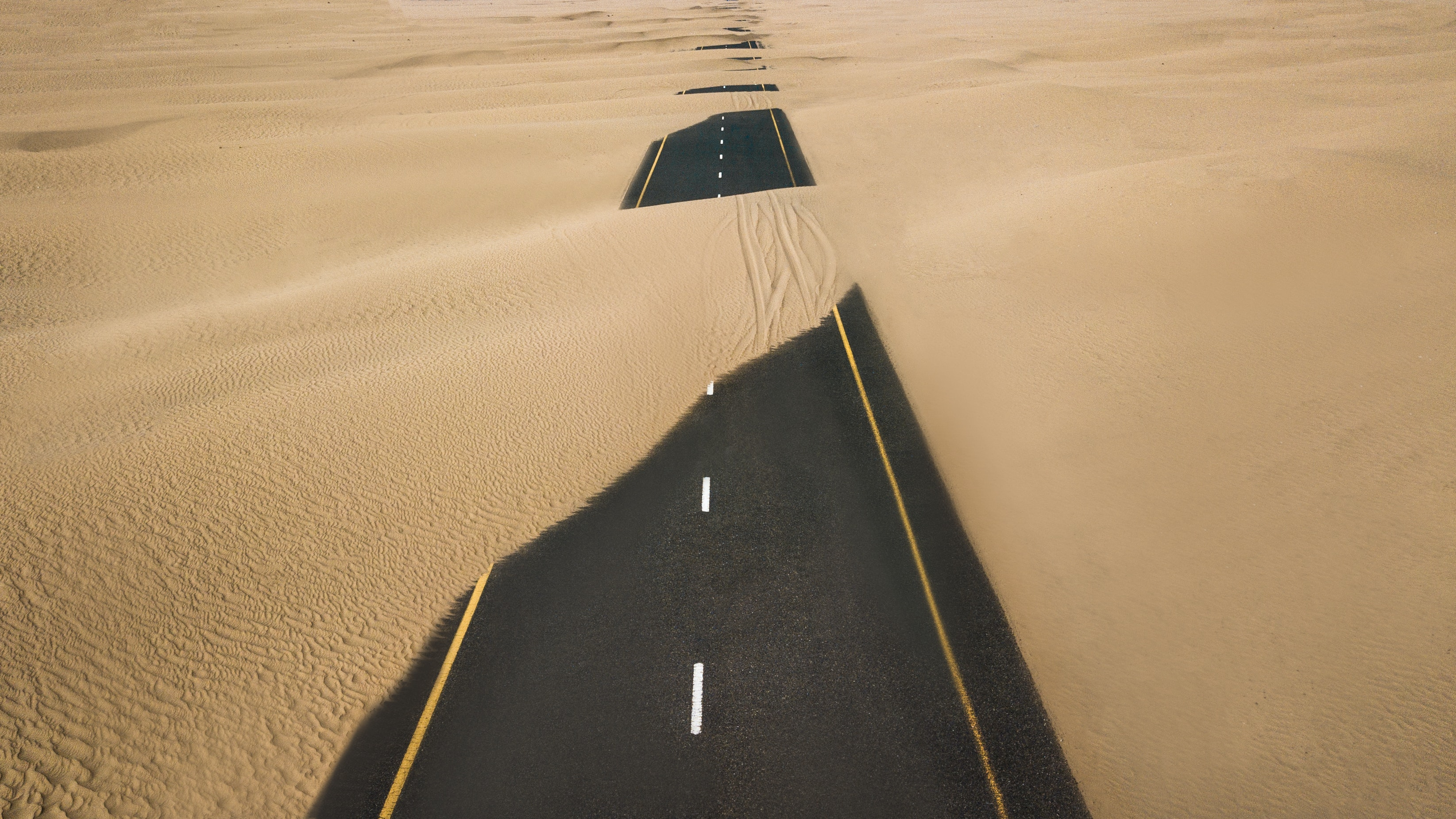 Road Covered in Sand Dunes by Antas Singh