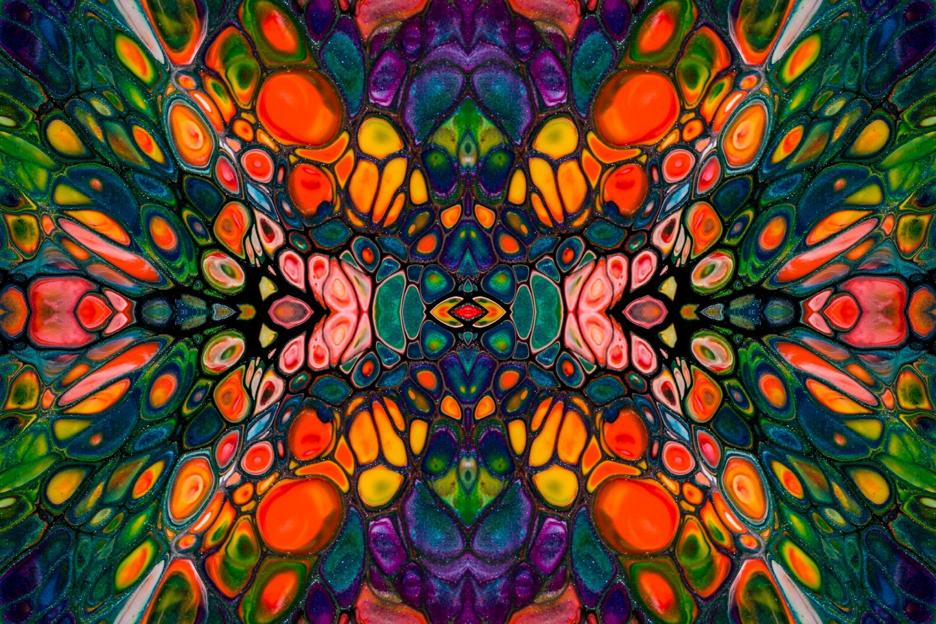 Abstract, colorful symmetrical organic mosaic in vivid reds, oranges, greens and purples — 4K Ultra HD PC desktop wallpaper background.