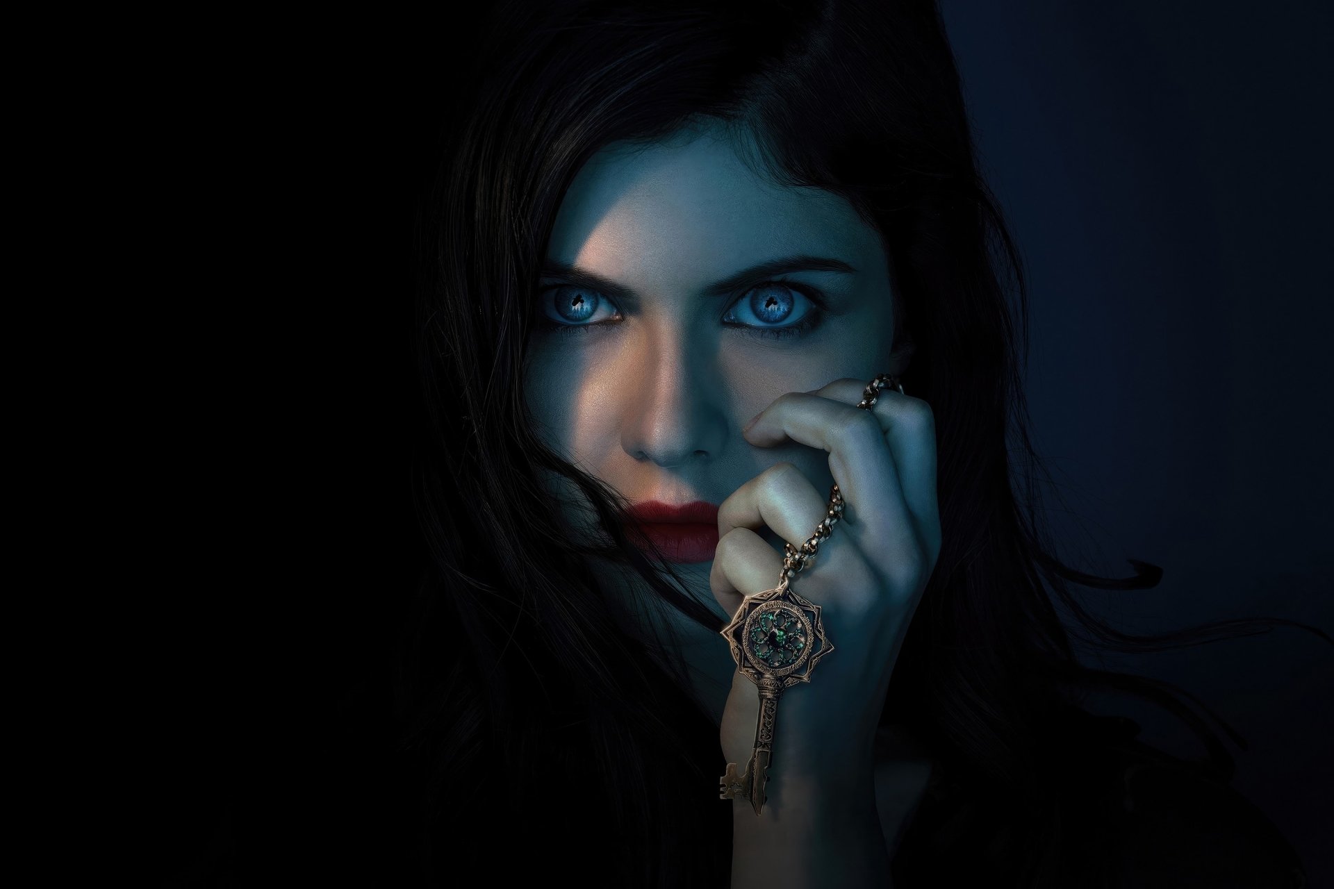 HD desktop wallpaper featuring Alexandra Daddario from the TV show Mayfair Witches, highlighting her intense gaze and mystical aura in dark, moody lighting.