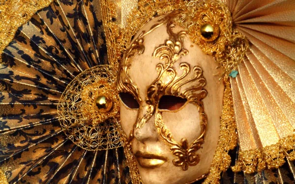 HD photography of an ornate Venetian-style mask with intricate gold detailing and decorative fans, designed as a PC desktop wallpaper and background.