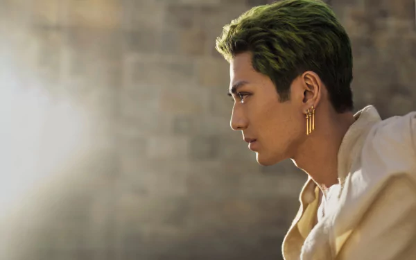 One Piece (Live Action) TV show portrait: Roronoa Zoro in profile with green hair, gold earrings and sunlight halo — 4K Ultra HD desktop wallpaper.