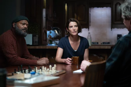 A dramatic scene from Secret Invasion, featuring three characters in a dimly lit kitchen, capturing an intense moment at the table with a chessboard in view.