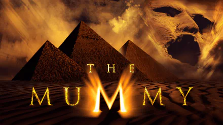HD PC desktop wallpaper featuring the pyramids and a ghostly face from the movie The Mummy (1999) with bold golden text overlay.