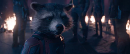 HD wallpaper featuring Rocket Raccoon from the movie Guardians of the Galaxy Vol. 3, showcasing his expressive character amidst a dramatic background.