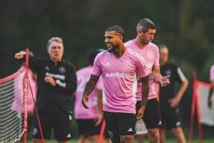 Inter Miami CF player in pink jersey laughing during training session, HD wallpaper for desktop background.