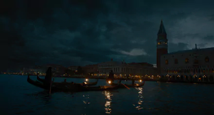 HD wallpaper featuring a mysterious evening view of Venice with a gondola lit by lanterns on the water, evoking the atmosphere of 'A Haunting in Venice'.