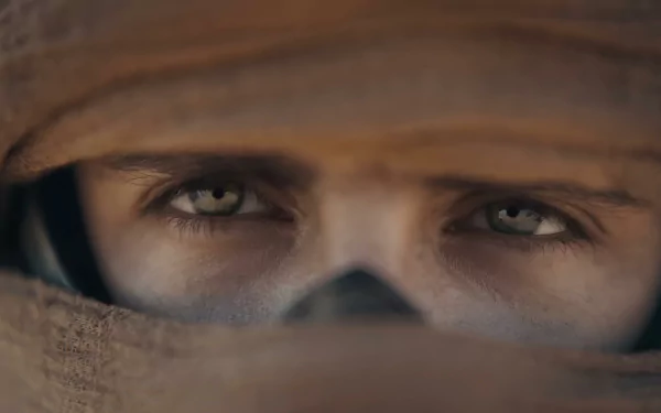 HD desktop wallpaper featuring a close-up of a character's intense eyes from Dune: Part Two.