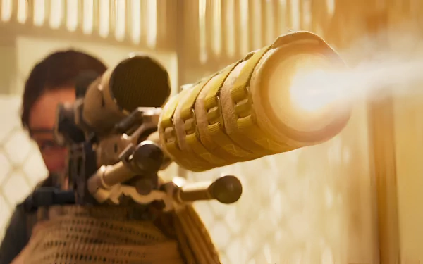 HD wallpaper featuring an intense scene from Mission: Impossible - Dead Reckoning Part One with a focused individual aiming a sniper rifle.